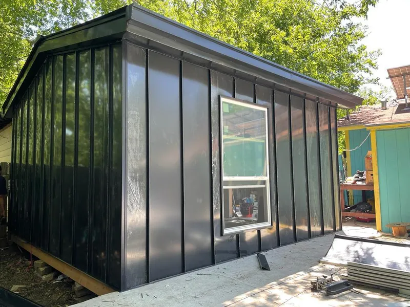 Black standing seam metal wall panels for Roof Inspection in Culpeper